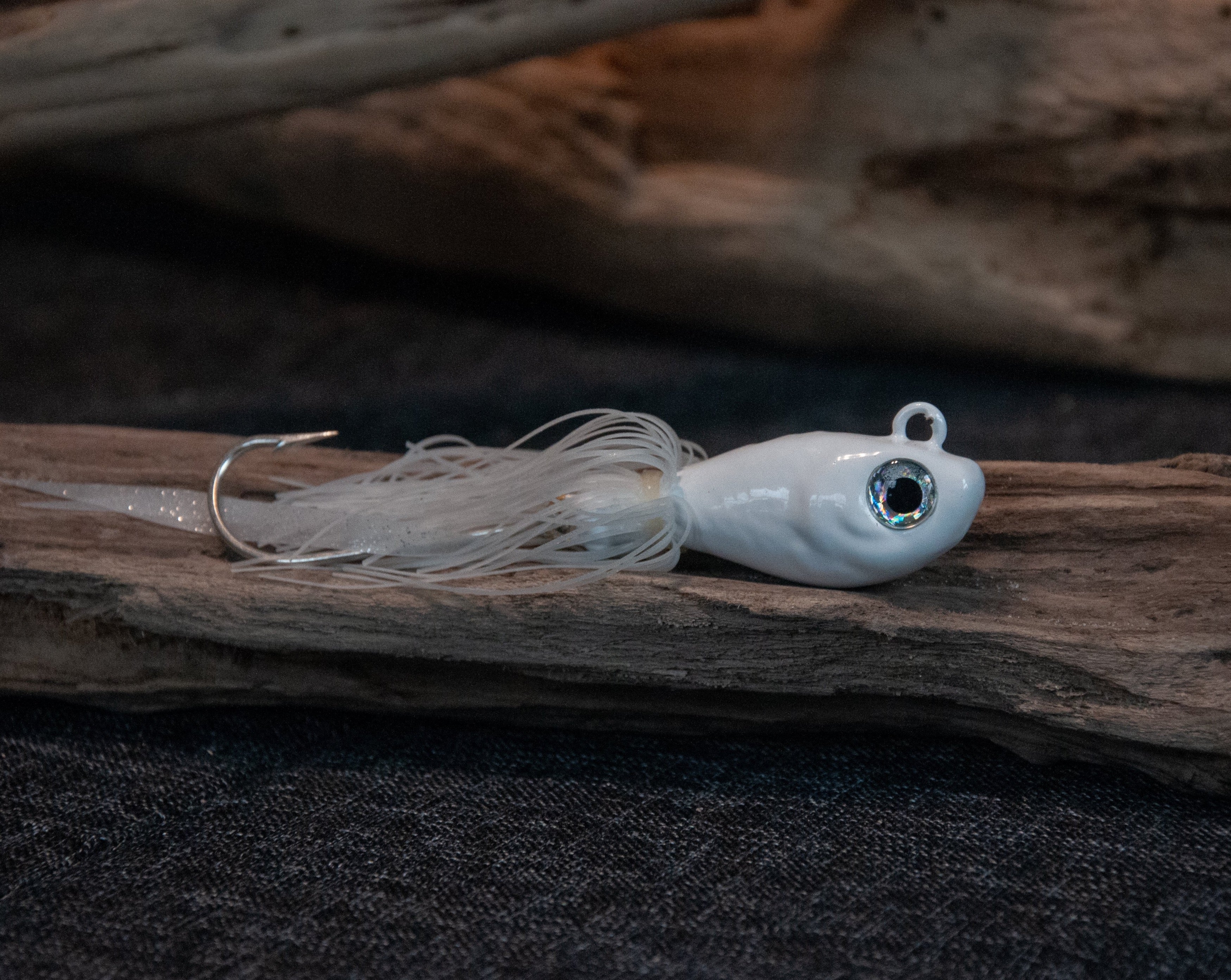 White 5oz swing hook bucktail jig for saltwater striped bass, fluke, black sea bass fishing.