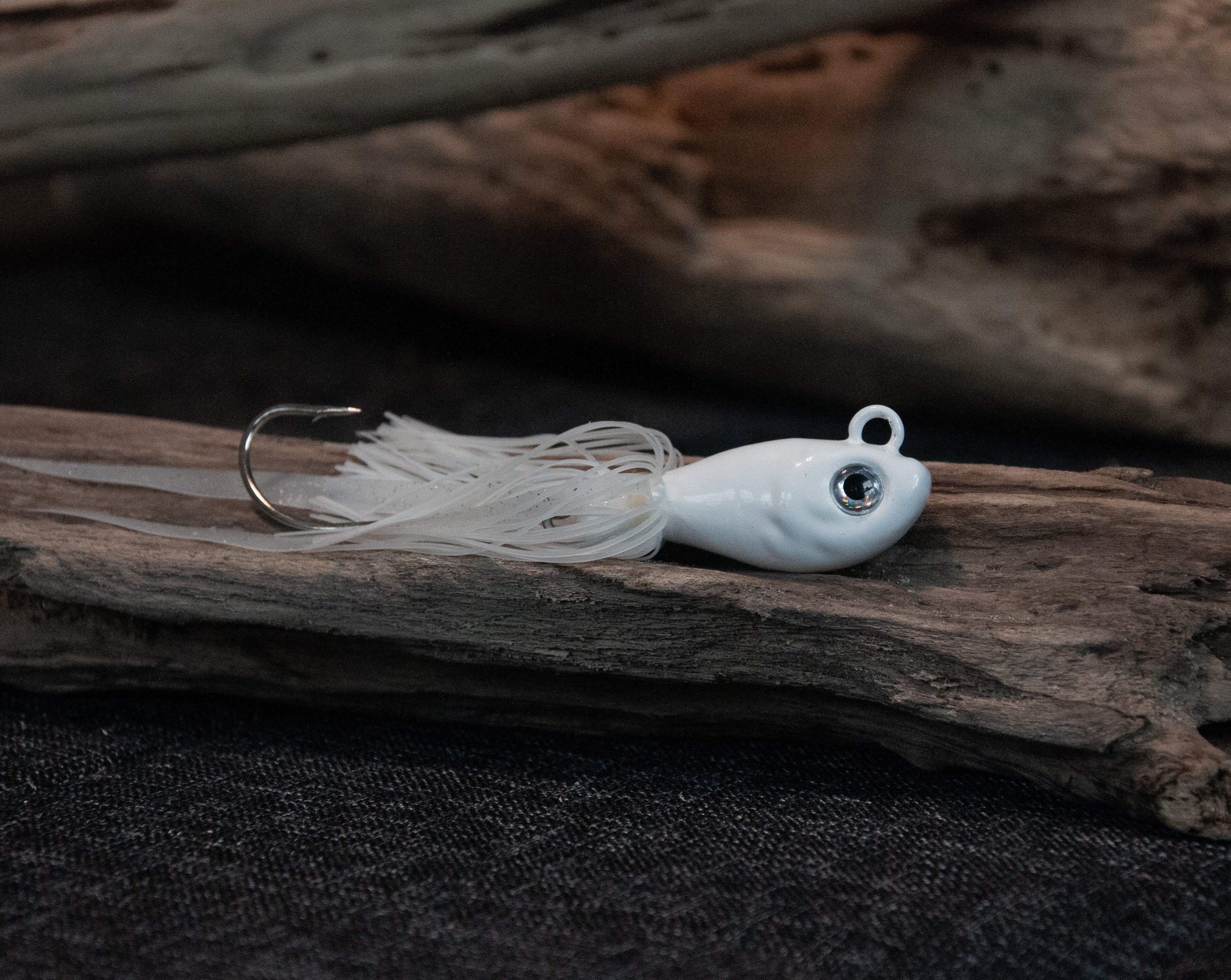 White 3oz swing hook bucktail jig for saltwater striped bass, fluke, black sea bass fishing.